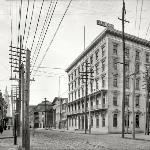 Note the many electric lines in this image of Downtown Charleston after the turn of the Century.  The building on the right is a hotel